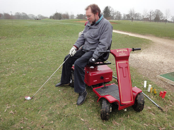 A player lining up a shot while seated on the Eventer